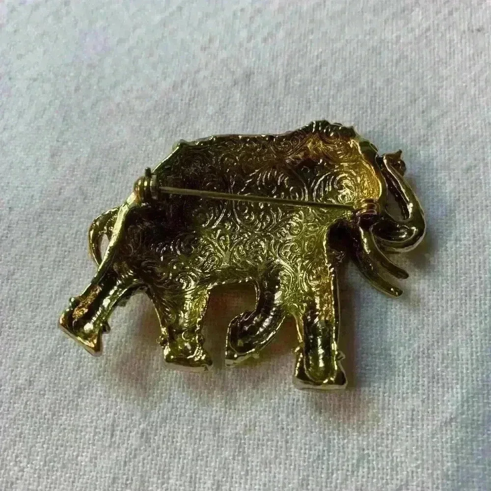 Vintage elephant, brooch, gold with bezel set rhinestones
